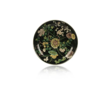 A FAMILLE VERTE DISH, centrally painted with a lotus and ruyi roundel from which issue flowering branches and stems, Kangxi p