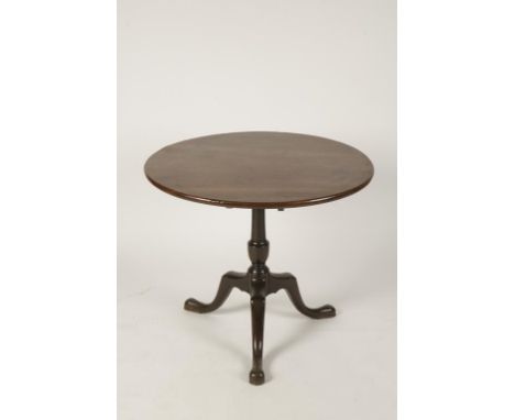 A GEORGE III MAHOGANY TRIPOD TABLE, the circular tip-up top on a vase-turned column with three outswept cabriole legs on pad 