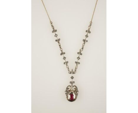 A 19TH CENTURY OLD-CUT DIAMOND PENDANT NECKLACE, the open scrollwork pendant circa 44mm long, with a later oval-cut ruby set 