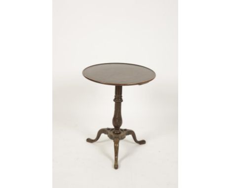 A GEORGE III STYLE MAHOGANY TRIPOD TABLE, the dish top on a fluted and stiff leaf carved turned column support ending in thre