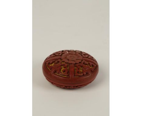 A CHINESE CINNABAR LACQUER SEAL PASTE BOX, the side carved with panels of stylised ruyi scrolls centred by a lotus blossom, 5