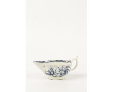 A FIRST PERIOD WORCESTER BLUE AND WHITE SAUCEBOAT with moulded body, pedestal foot and spur capped scroll handle, decorated i