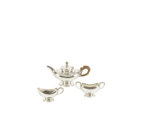 OMAR RAMSDEN: AN ARTS AND CRAFTS SILVER THREE PIECE TEA SET of undulating oval form, the teapot with a domed hinged cover sur