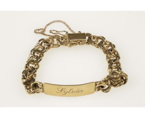 A 9CT YELLOW GOLD IDENTITY BRACELET inscribed "Sylvia", on a flat entwined ring bracelet with concealed clasp and safety chai