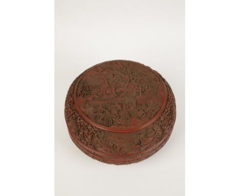 A LARGE CINNABAR LACQUER BOX, the domed box carved in relief throughout with figures, trees and pagoda in a mountain landscap