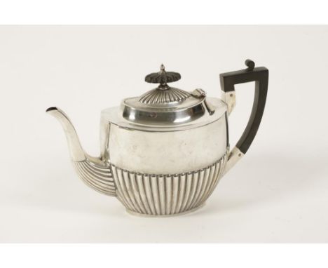 A SILVER TEAPOT, tapering oval form, part fluted decoration, by Walker and Hall, Sheffield, 1919, 7.5" high, (c.20.3oz)