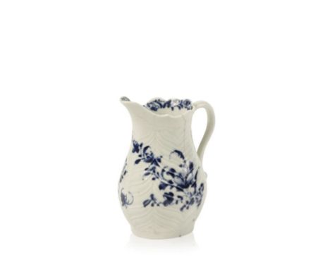A FIRST PERIOD WORCESTER BLUE AND WHITE FEATHER MOULDED CREAM JUG decorated with sprays of flowers, workman's mark to base, c