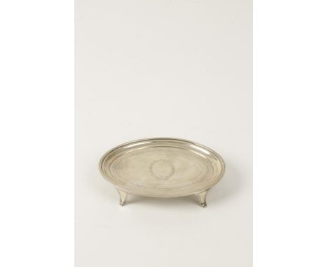 A GEORGE III SILVER TEAPOT STAND, oval form with raised border, decorated with a band of fern leaves, on four shaped feet, by