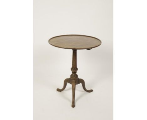 A LATE GEORGE III MAHOGANY TRIPOD TABLE, the circular dish top on a turned column support, terminating in three cabriole legs