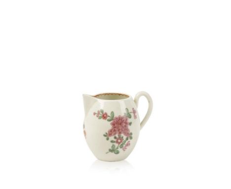 A FIRST PERIOD WORCESTER BARREL-SHAPED POLYCHROME CREAM JUG with sparrowbeak spout and simple loop handle, decorated with spr