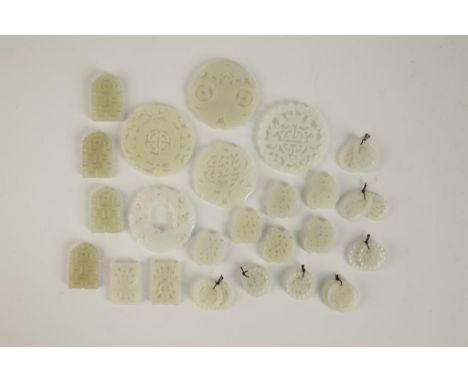 A QUANTITY OF WHITE AND CELADON JADE PENDANTS, various sizes and styles