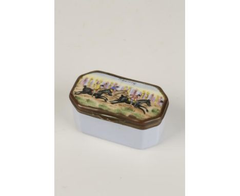 A GEORGIAN ENAMEL PATCH BOX of oblong form, the hinged cover with a scene of horse racing, entitled "Racing" with metal mount