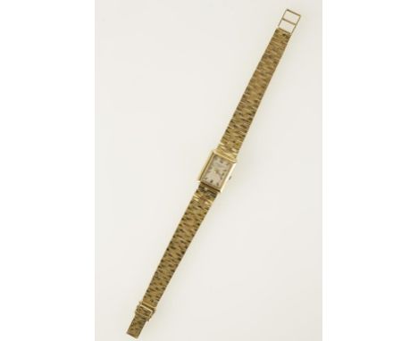PATEK PHILLIPE: A LADIES 18K YELLOW GOLD WRISTWATCH, the rectangular dial with Arabic and baton numerals, inscribed "Patek Ph