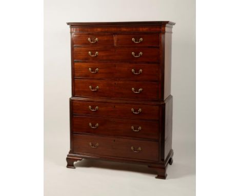 A GEORGE III MAHOGANY CHEST ON CHEST, the dentil moulded cornice above two short and three long drawers, flanked by reeded ca