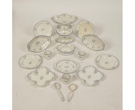 A SPODE CREAMWARE PART DINNER AND TEA SERVICE with painted floral sprigs on cream ground within blue-lined borders. Comprisin