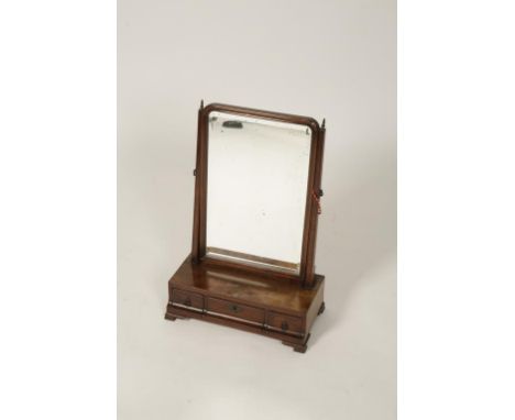 A GEORGE III MAHOGANY TOILET MIRROR, the moulded adjustable mirror with a rectangular bevelled plate above an ogee form base 