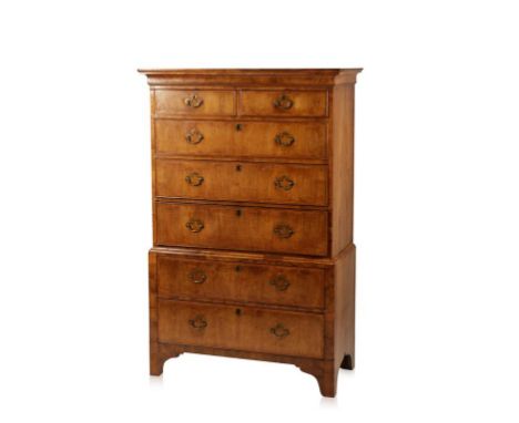 A GEORGE II WALNUT CHEST ON CHEST, the upper section with a moulded cornice above two short and three long graduated drawers 