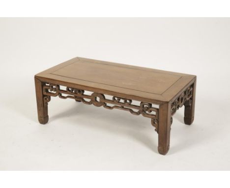 A CHINESE HONGMU KONG, the cleated rectangular top above an openwork frieze, on square section legs with scroll feet, 28cm hi