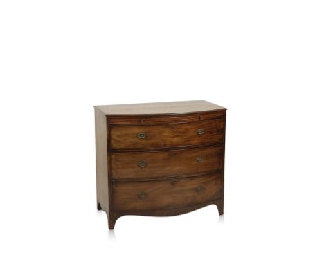 A REGENCY MAHOGANY BOW-FRONT CHEST OF DRAWERS, the shaped top with a moulded edge above a brushing slide and three long drawe
