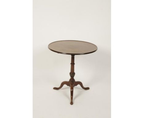 A LATE GEORGE III MAHOGANY TILT-TOP TABLE, the circular dished top on a fluted variform column support ending in a tripod bas