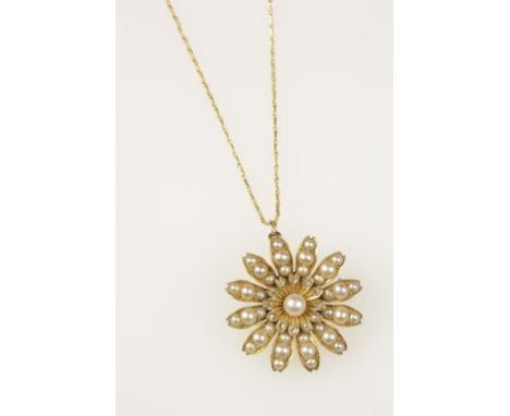 A PEARL AND DIAMOND BROOCH PENDANT, the flower centre decorated with a single pearl surounded by diamond set petals and outer