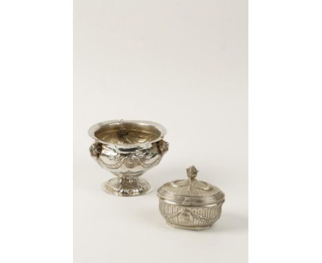 A CONTINENTAL SILVER TEA CADDY, of oval form, the hinged lid with lotus flower finial, decorated with garlands, with two bust