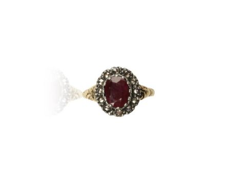 A RUBY AND ROSE DIAMOND DRESS RING, the central oval-cut ruby surrounded by a border of rose diamonds, with enclosed yellow m