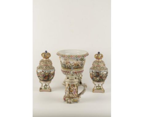 A PAIR OF ITALIAN DOCCIA STYLE PORCELAIN VASES AND COVERS, the body with a polychrome painted and raised battle scene below a