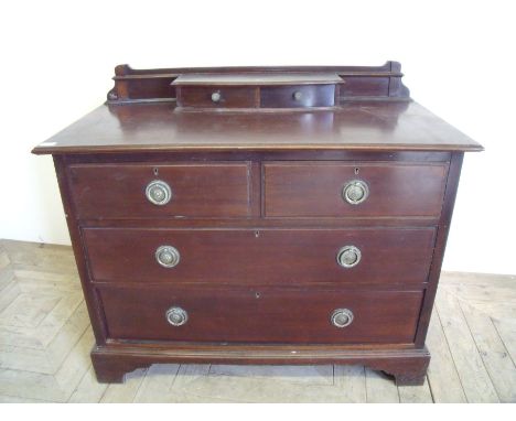 Early-mid 20th C mahogany chest with raised back with two drawers above two further short drawers and two long drawers on rai