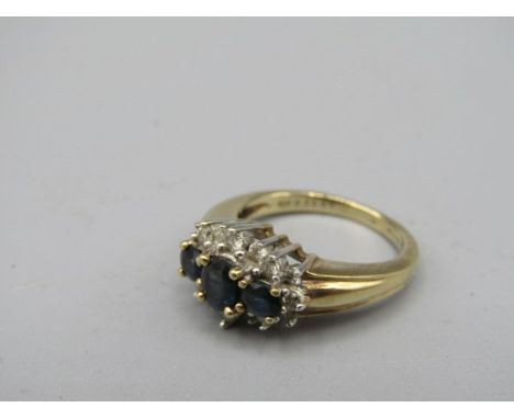 9ct gold Diamond and Sapphire ring 4.6gms stamped 9ct 035ct SIZE K