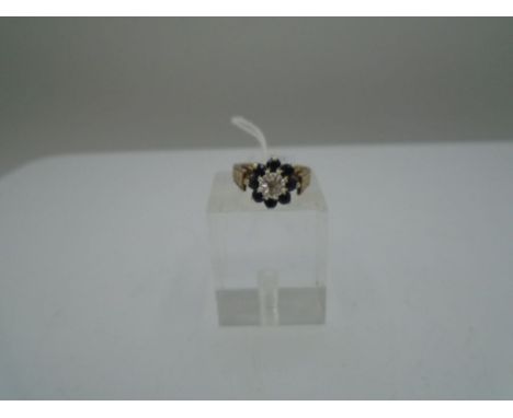 9ct Gold and Dark Sapphire Ring, gross weight 3.5g size K