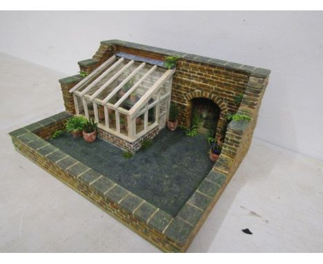 A scratch built walled garden with greenhouse made for Hampton Court Palace RHS flowershow in 1996.26cmW 12.5cm H 20cmD      