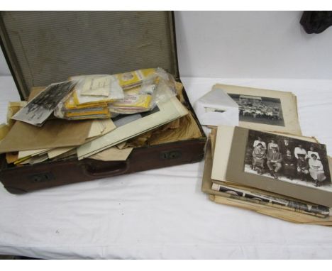 A collection of vintage family photo's and ephemera in a vintage suitcase