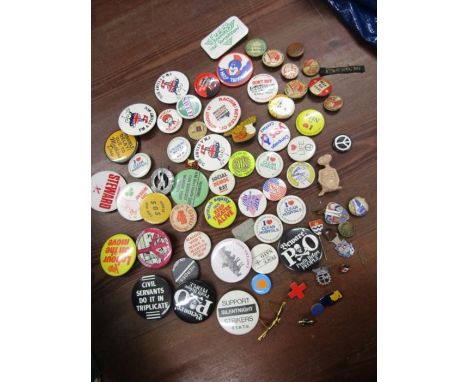 A collection of vintage badges including 1940s