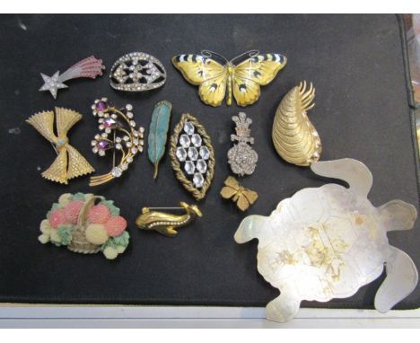 A quantity of brooches some named and a metal turtle trinket dish