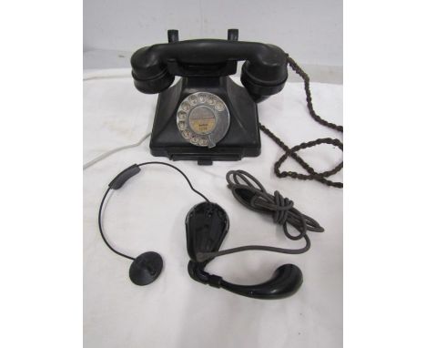 A vintage tepephone and switchboard earpiece