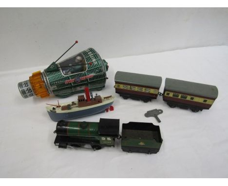 A vintage tin Nasa space capsule, Triang boat,  Hornby- type 3- train and carriage and 2 Hornby carriages and key gauge