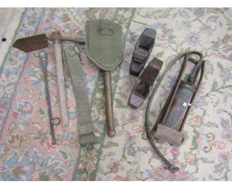 2 entrenching tools, military belt, vintage Dunlop foor pump, 2 wood planes and a cattle pill popper?