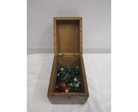 A vintage box of marbles