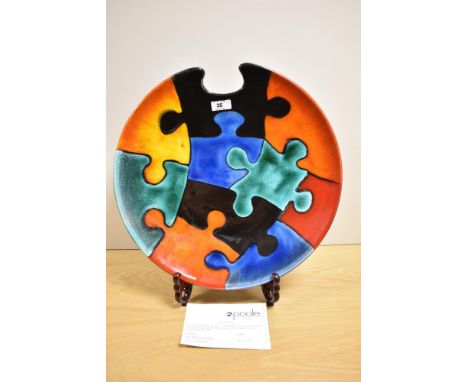 A 20th Century Poole pottery charger, of Jigsaw Puzzle design, a limited edition 144 of 250, signed 'N.Massarella' (Nicky Mas