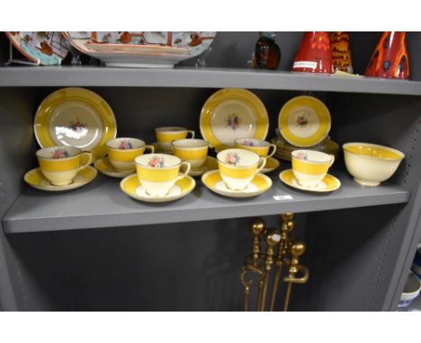 An early 20th Century Crown Staffordshire tea set, approx. 20 pcs, decorated with a foliate motif against a yellow banded gro