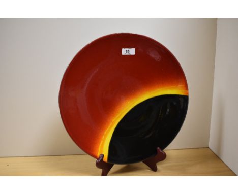 A 20th Century Poole pottery charger, in the 'Eclipse' design, measuring 35cm in diameter