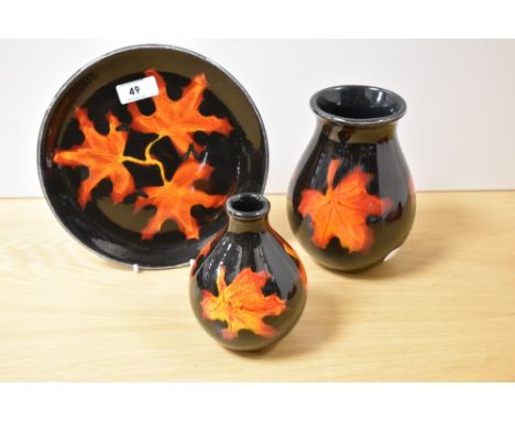 Two 20th Century Poole pottery vases and dish, in the Forest Flame pattern, the largest vase measures 16cm tall
