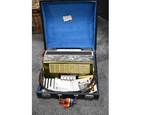 An Eastern European accordion , with hard case