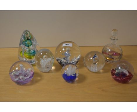 Seven assorted paperweights and a similar scent bottle including Karl Ittig 2015, Caithness and Selkirk glass etc.
