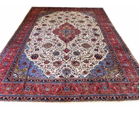 FINE PERSIAN ISPHAHAN DESIGN CARPET, 404cm x 292cm, central medallion on an ivory palmette and vine field within complimentar