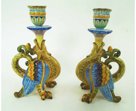 PR CANTAGALLI MAJOLICA CANDLESTICKS, modelled as brightly coloured fantastic winged beasts, cockerel backstamp, each 20.5cm H
