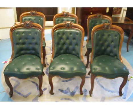 DINING CHAIRS, a set of six, Victorian oak framed, each with a circular portrait medallion and green buttoned leatherette uph