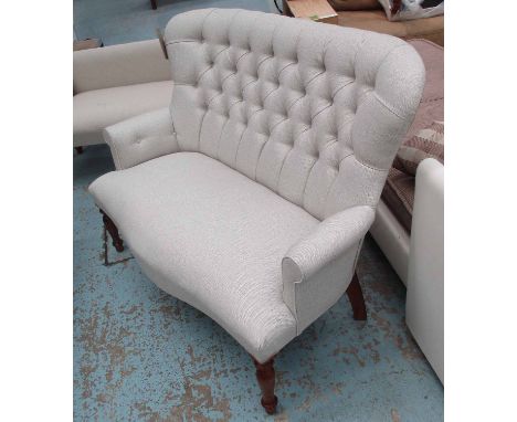 SOFA, two seater, in neutral buttoned fabric on turned supports, 123cm L.