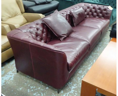 NATUZZI SOFA, in buttoned back burgundy leather, 90cm x 71cm H x 240cm.   